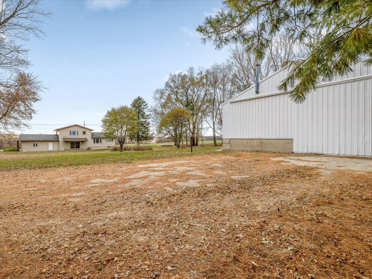 2110 East Angle Road Dakota, IL 61018 - Photo 4 of 47 a backyard of a house with lots of green space