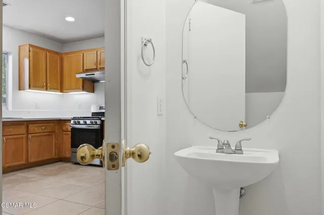 a bathroom with a sink double vanity and a mirror