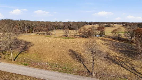 a view of a lake with houses in the back