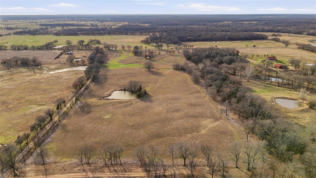 36200 County Line Road Sumner, TX 75486 - Photo 24 of 25 a view of a lake with a mountain