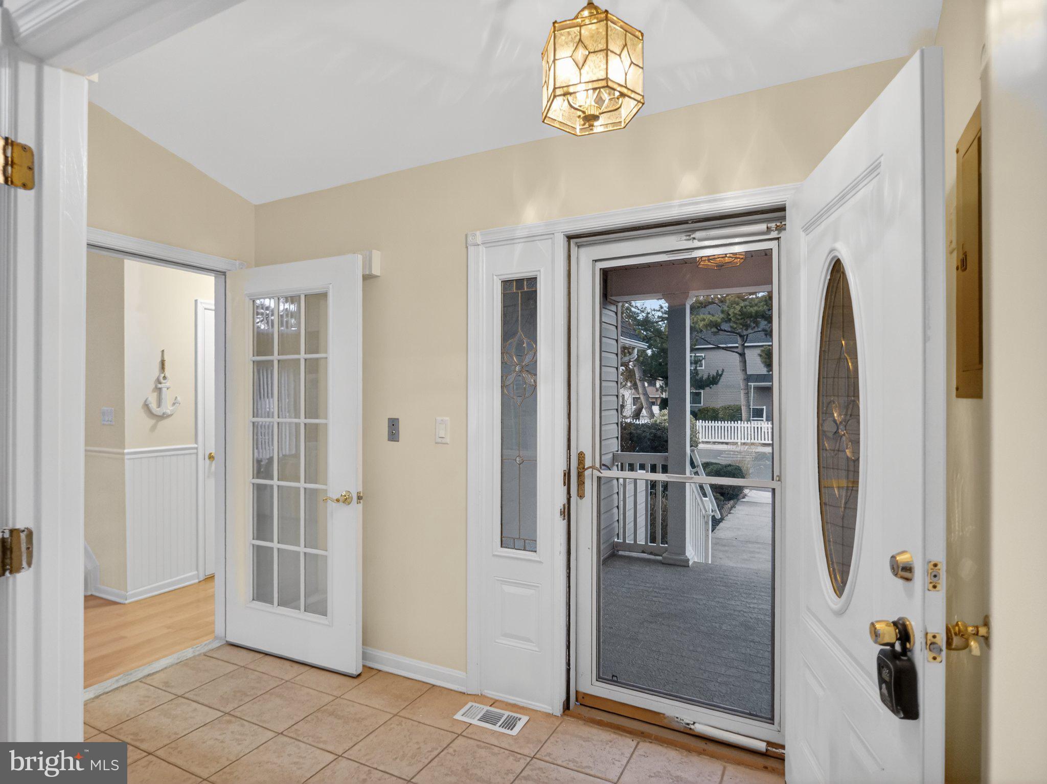 103 Channel Buoy Road Ocean City, MD 21842 - Photo 27 of 29 Welcoming entryway with natural light.