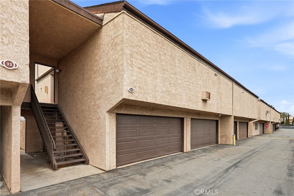 7890 East Spring Street, Unit 11E Long Beach, CA 90815 - Photo 40 of 40 a view of a house with garage