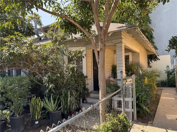 a view of a house with a tree