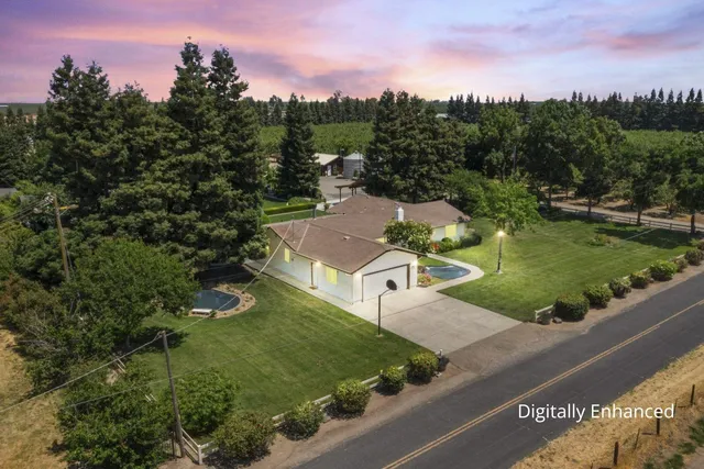 a view of a garden with a building in the background