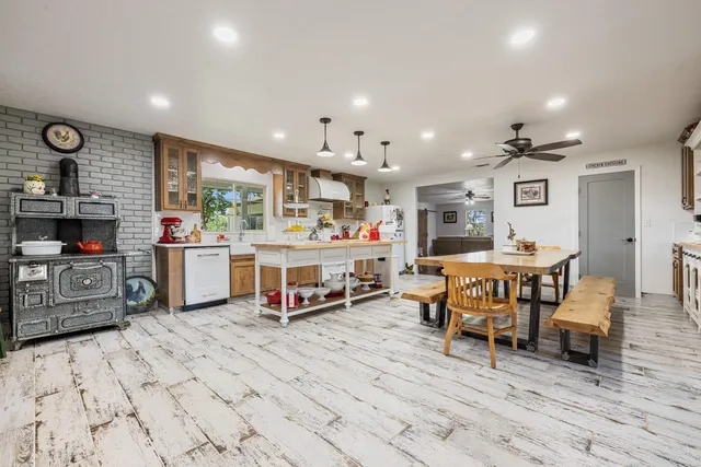 a spacious bedroom with a bed and a window