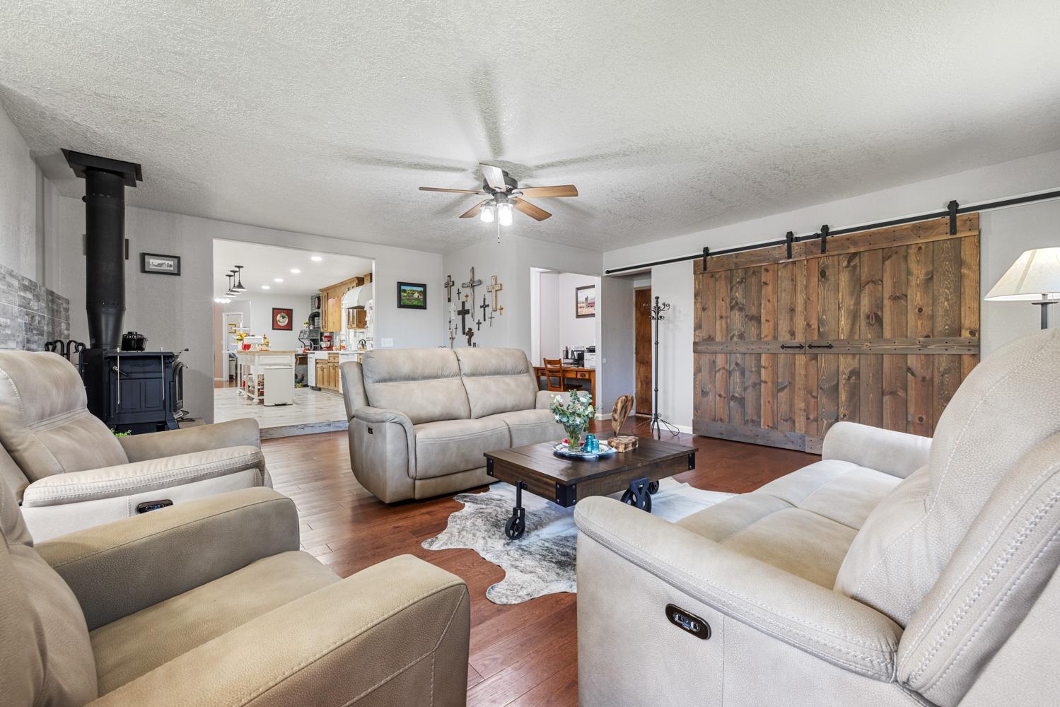 4742 Crow Road Oakdale, CA 95361 - Photo 18 of 95 a living room with furniture and a chandelier
