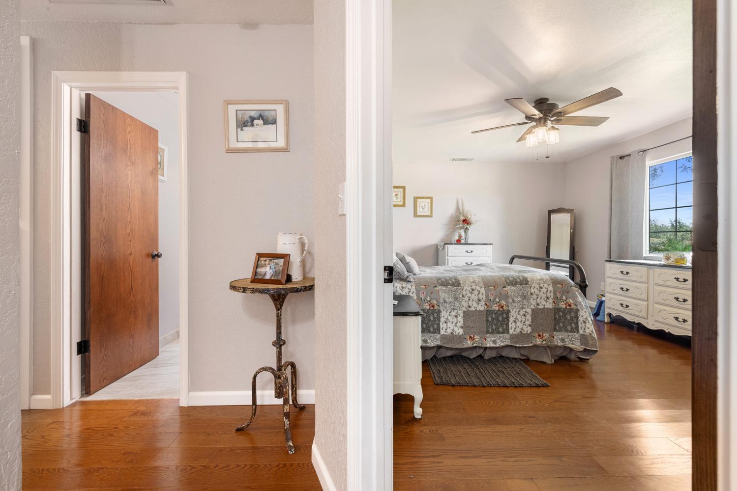 4742 Crow Road Oakdale, CA 95361 - Photo 22 of 95 a bedroom with a bed and wooden floor