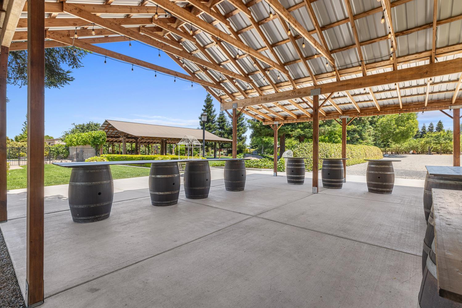 4742 Crow Road Oakdale, CA 95361 - Photo 47 of 95 a view of a patio with a table and chairs next to a yard
