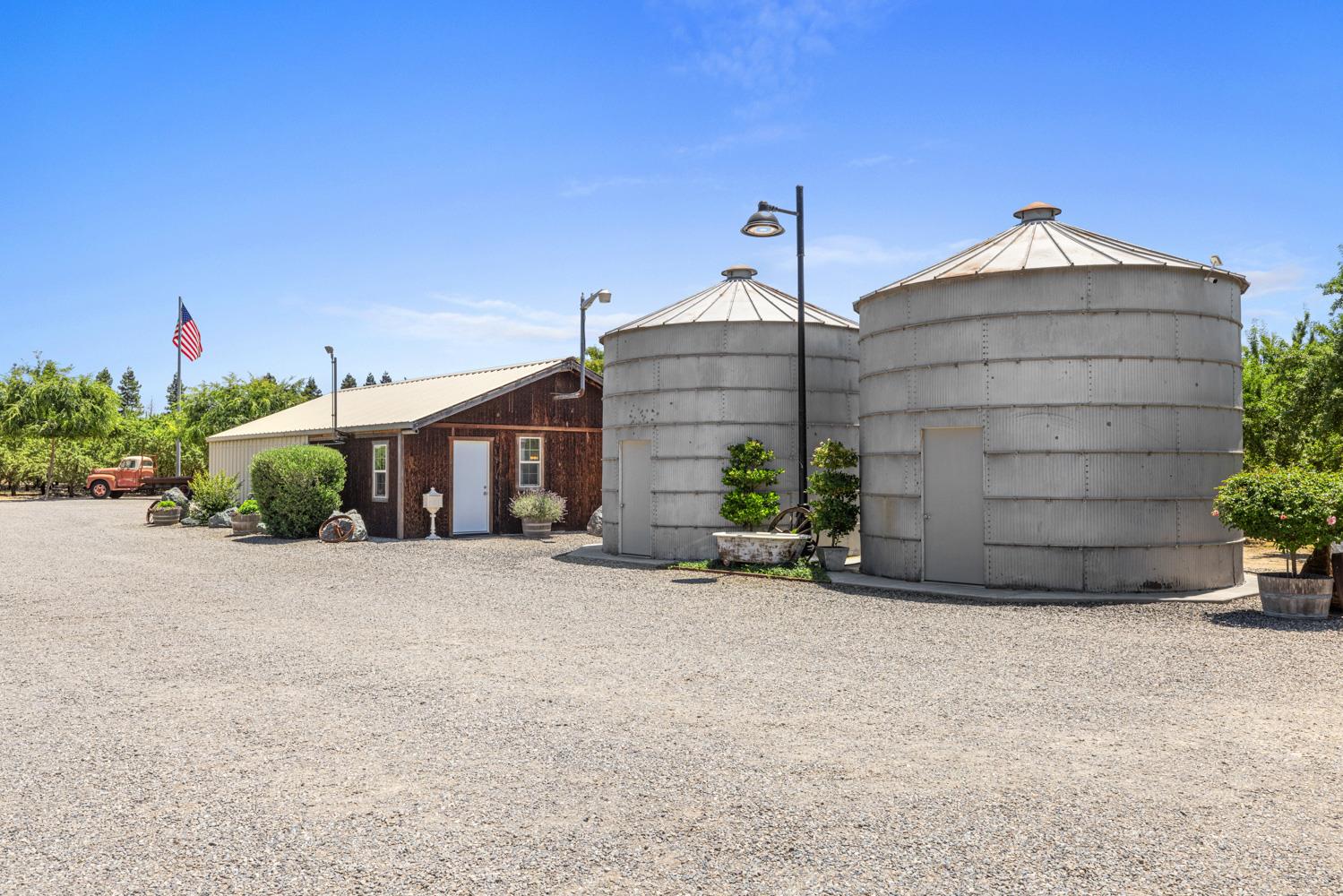 4742 Crow Road Oakdale, CA 95361 - Photo 49 of 95 a view of a house with a yard and potted plants