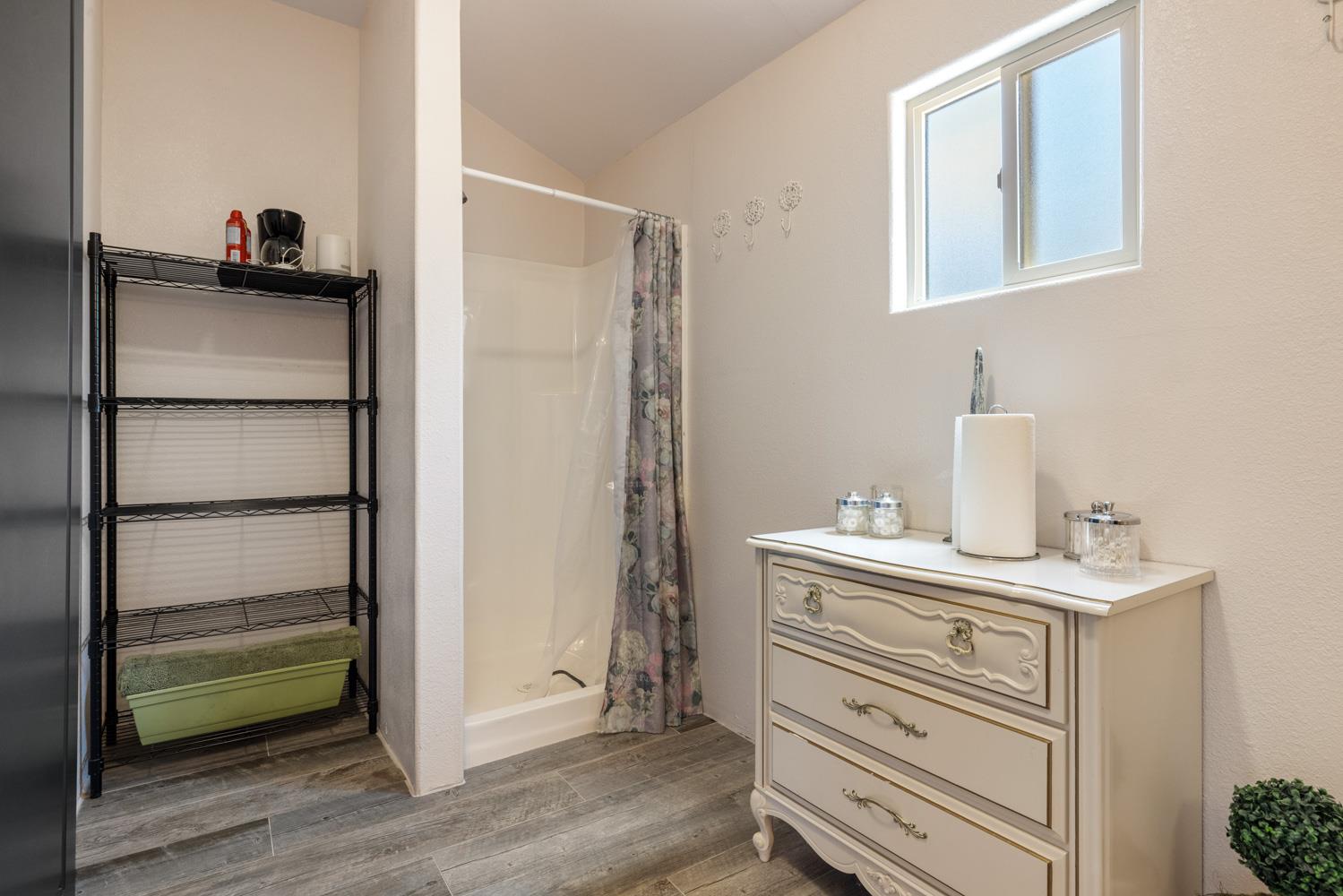 4742 Crow Road Oakdale, CA 95361 - Photo 53 of 95 a view of bathroom with a sink and a mirror