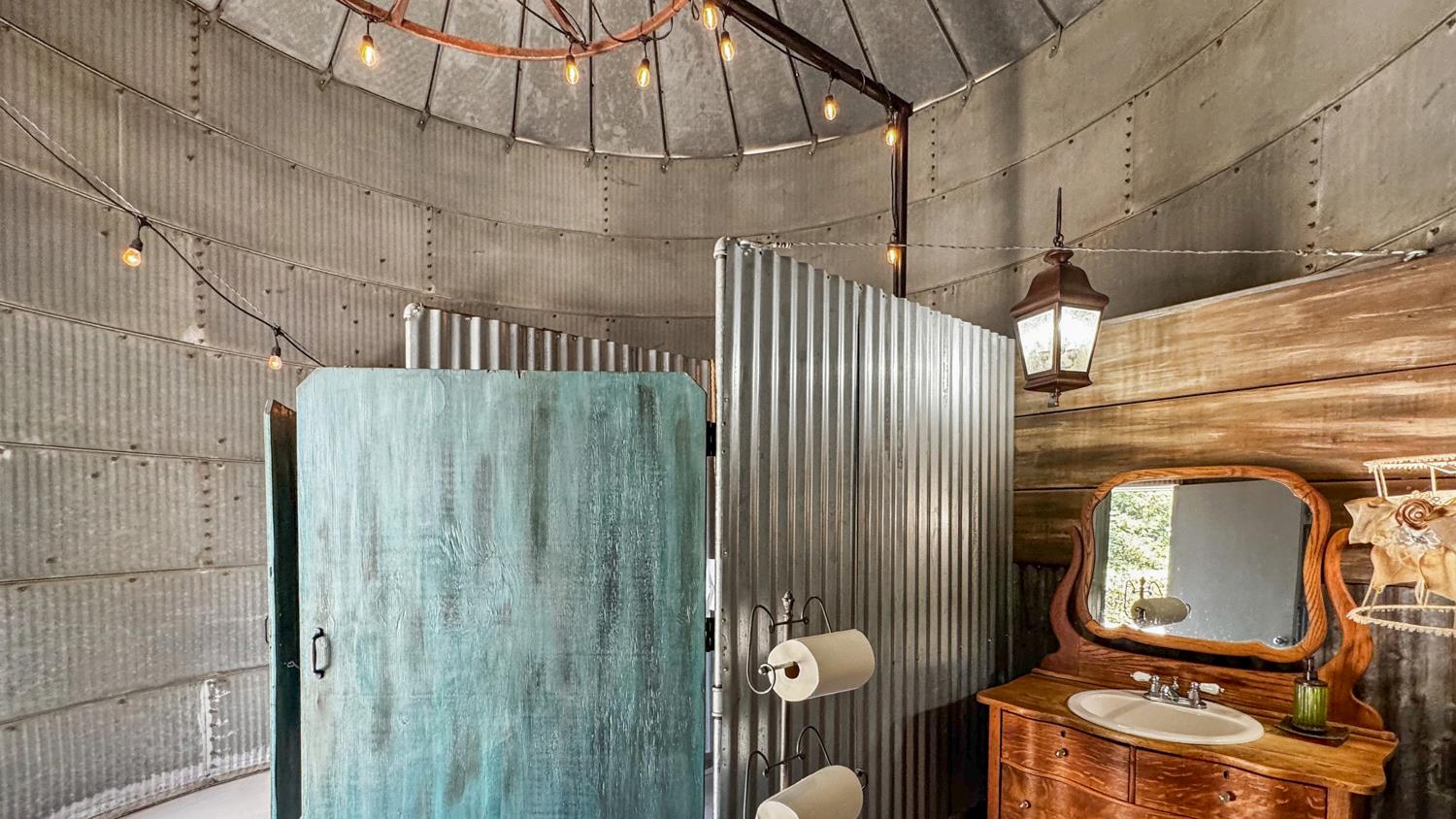 4742 Crow Road Oakdale, CA 95361 - Photo 75 of 95 a bathroom with a toilet a sink and mirror