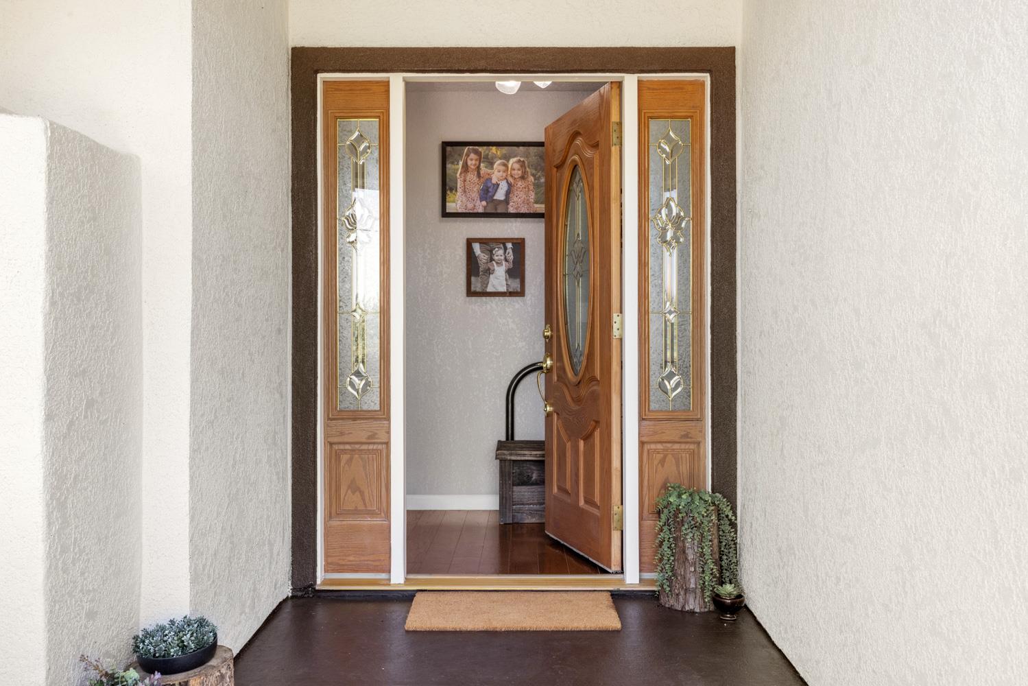 4742 Crow Road Oakdale, CA 95361 - Photo 9 of 95 a view of a hallway with wooden floor