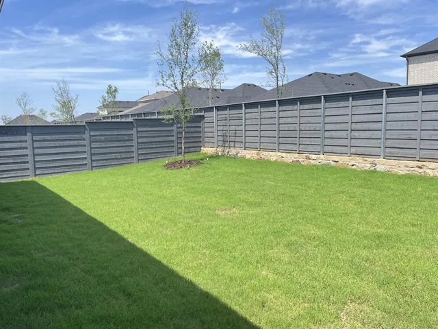 a view of a backyard with a garden