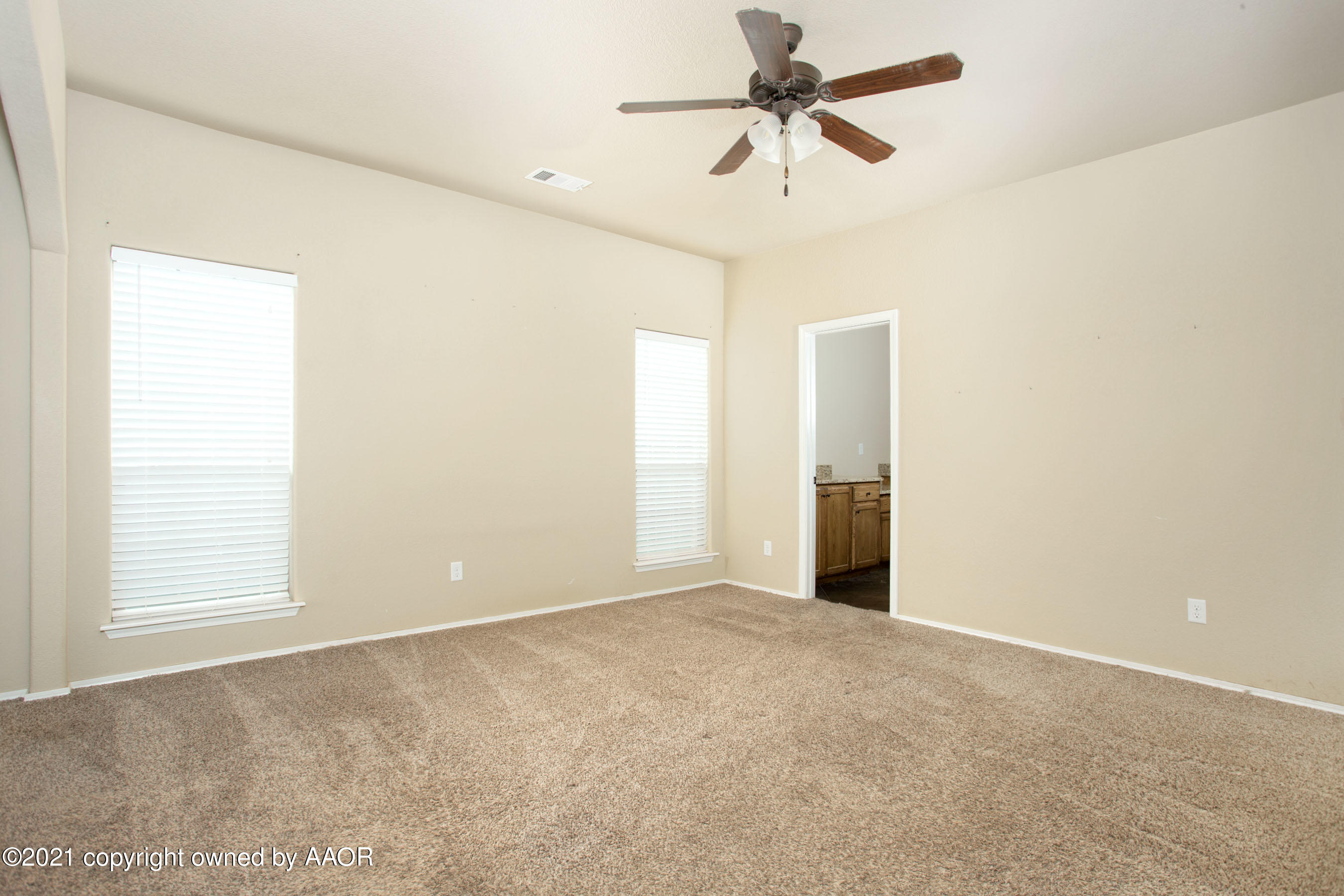 9907 Asher Avenue Amarillo, TX 79119 - Photo 12 of 24 a view of an empty room with a window