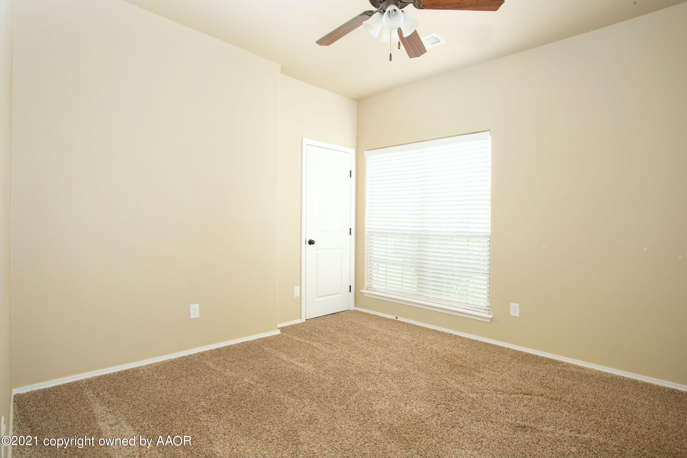 9907 Asher Avenue Amarillo, TX 79119 - Photo 16 of 24 an empty room with a window