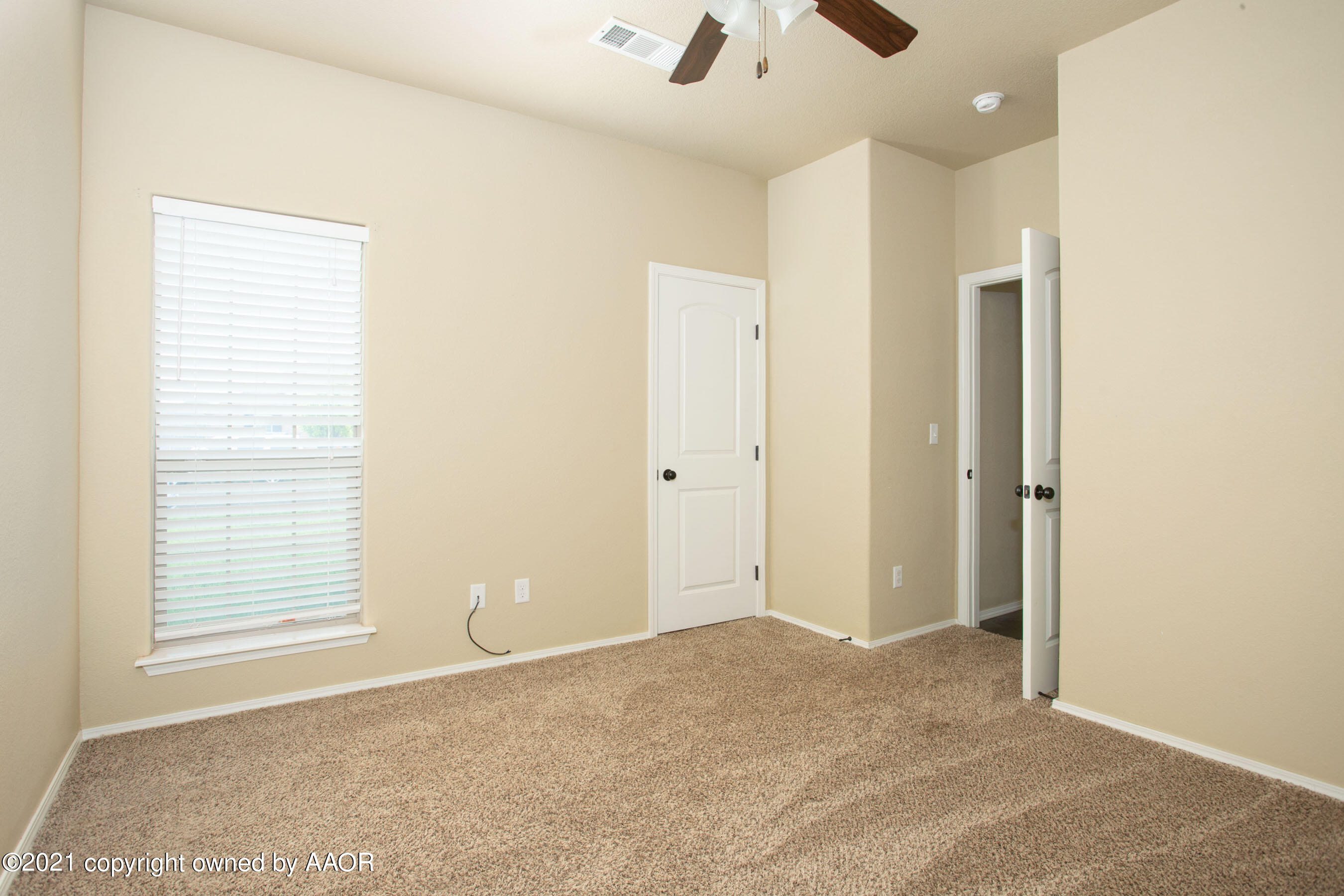 9907 Asher Avenue Amarillo, TX 79119 - Photo 17 of 24 a view of an empty room with a window