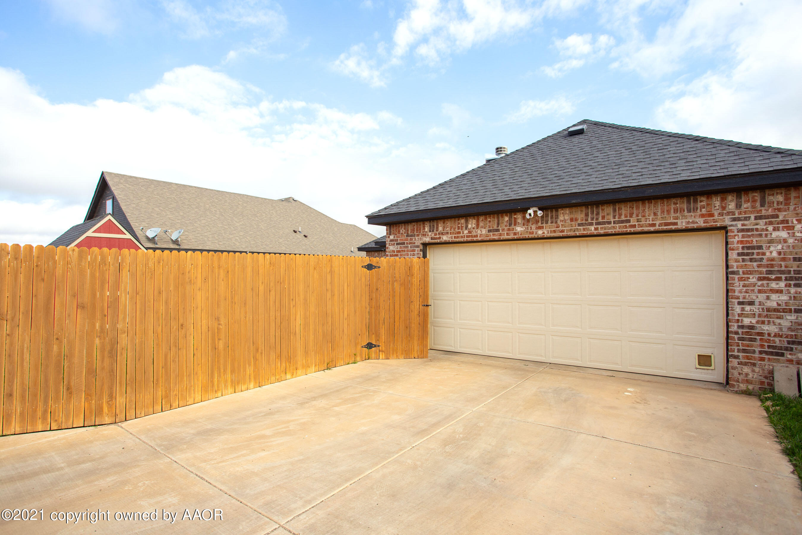 9907 Asher Avenue Amarillo, TX 79119 - Photo 24 of 24 a front view of a house with a garage