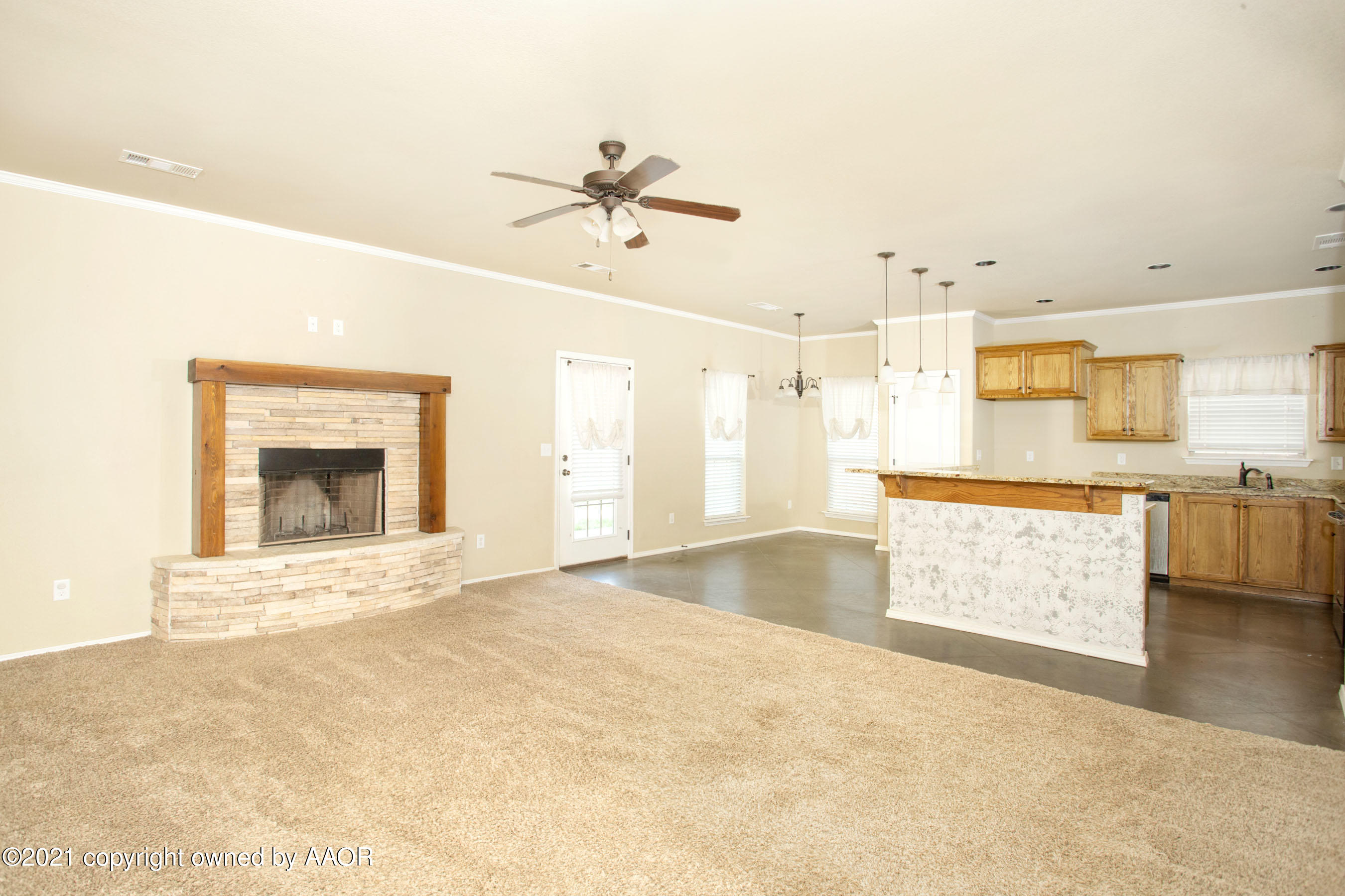 9907 Asher Avenue Amarillo, TX 79119 - Photo 4 of 24 a view of an empty room with kitchen appliances and a kitchen view