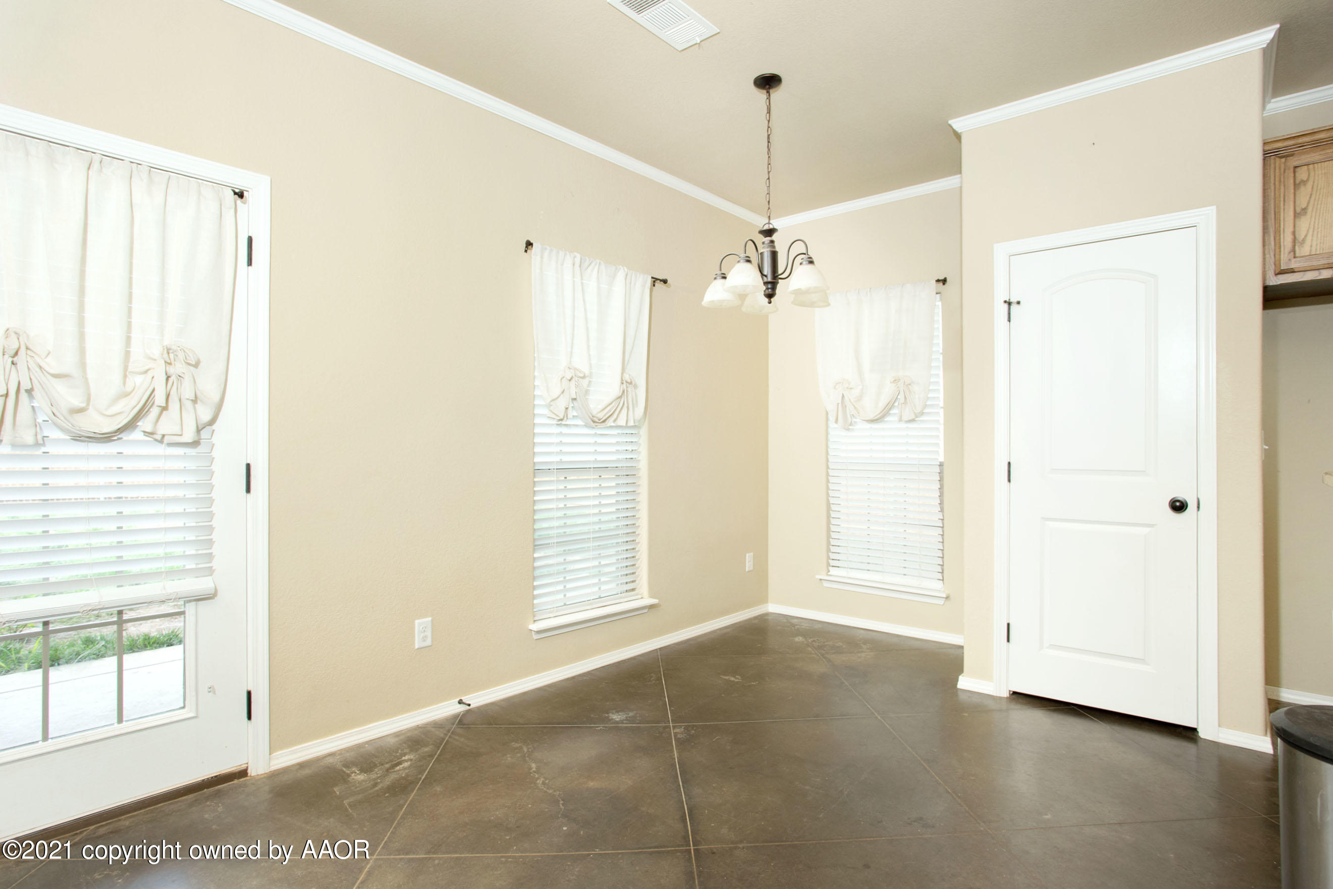 9907 Asher Avenue Amarillo, TX 79119 - Photo 10 of 24 a view of an empty room with a window