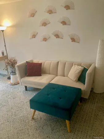 a living room with furniture and a rug