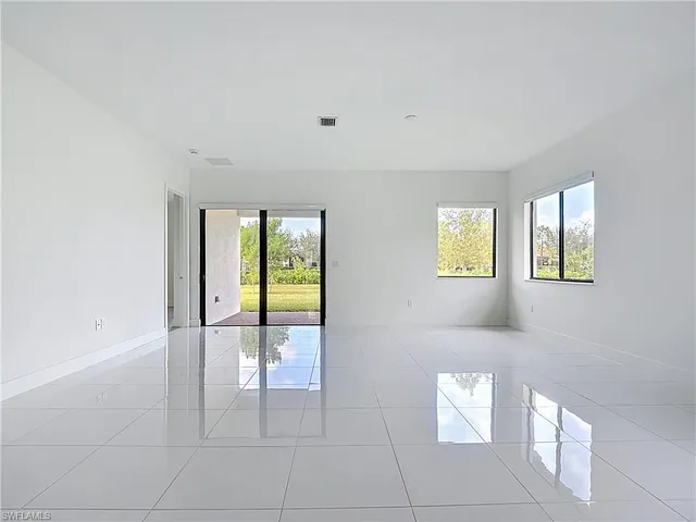 a view of an empty room and window