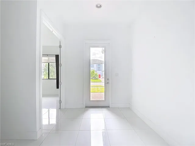 a view of an empty room and window