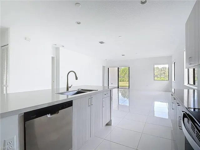 a kitchen with a sink and a window