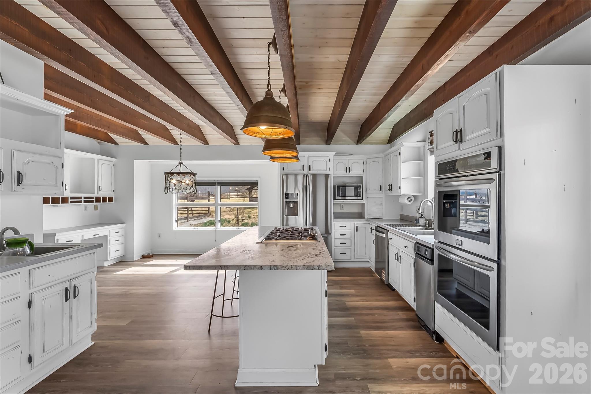 2590 Airport Road Marion, NC 28752 - Photo 11 of 48 a kitchen with stainless steel appliances granite countertop a sink a stove and cabinets