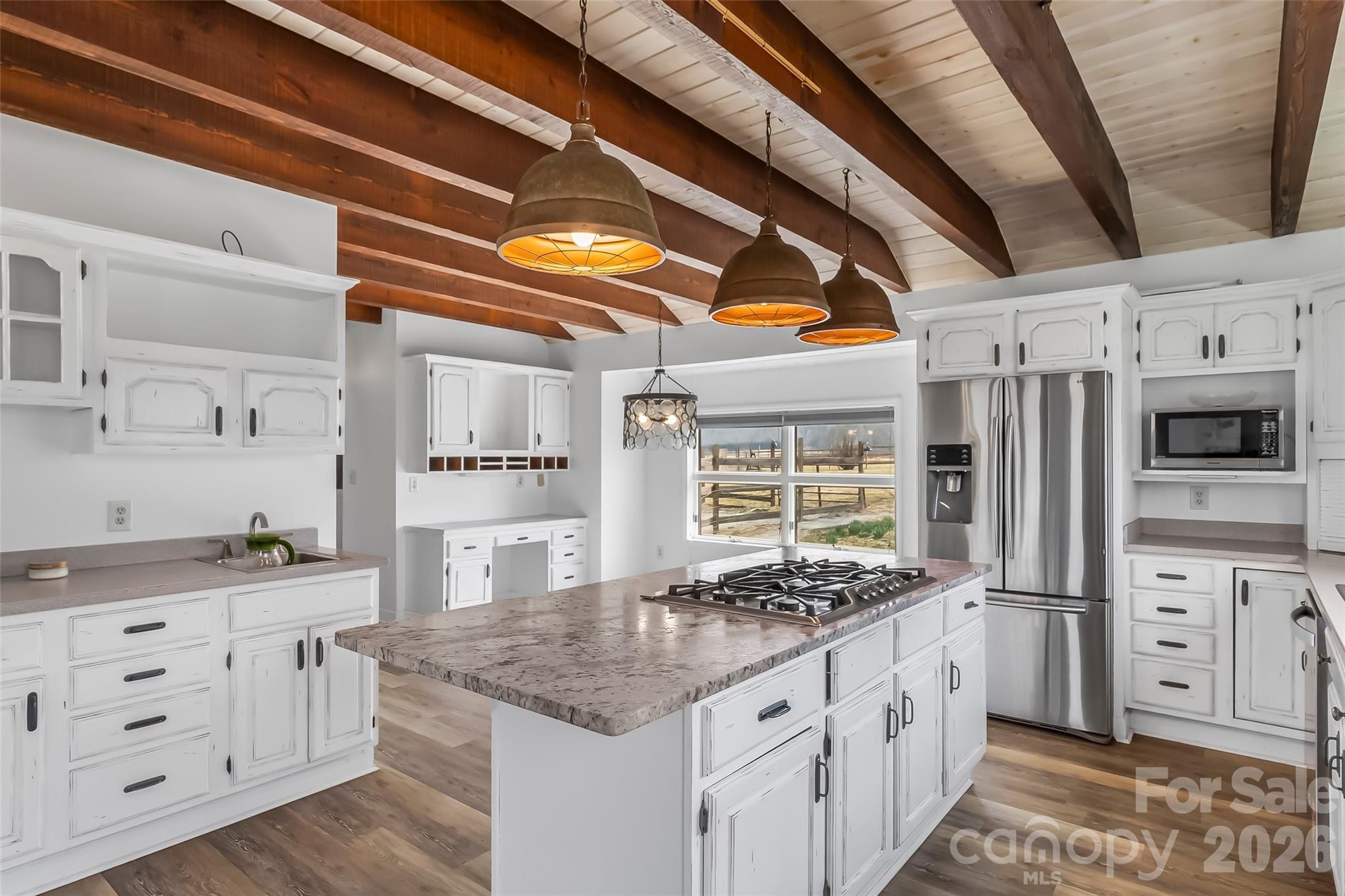 2590 Airport Road Marion, NC 28752 - Photo 12 of 48 a kitchen with stainless steel appliances granite countertop a sink and cabinets