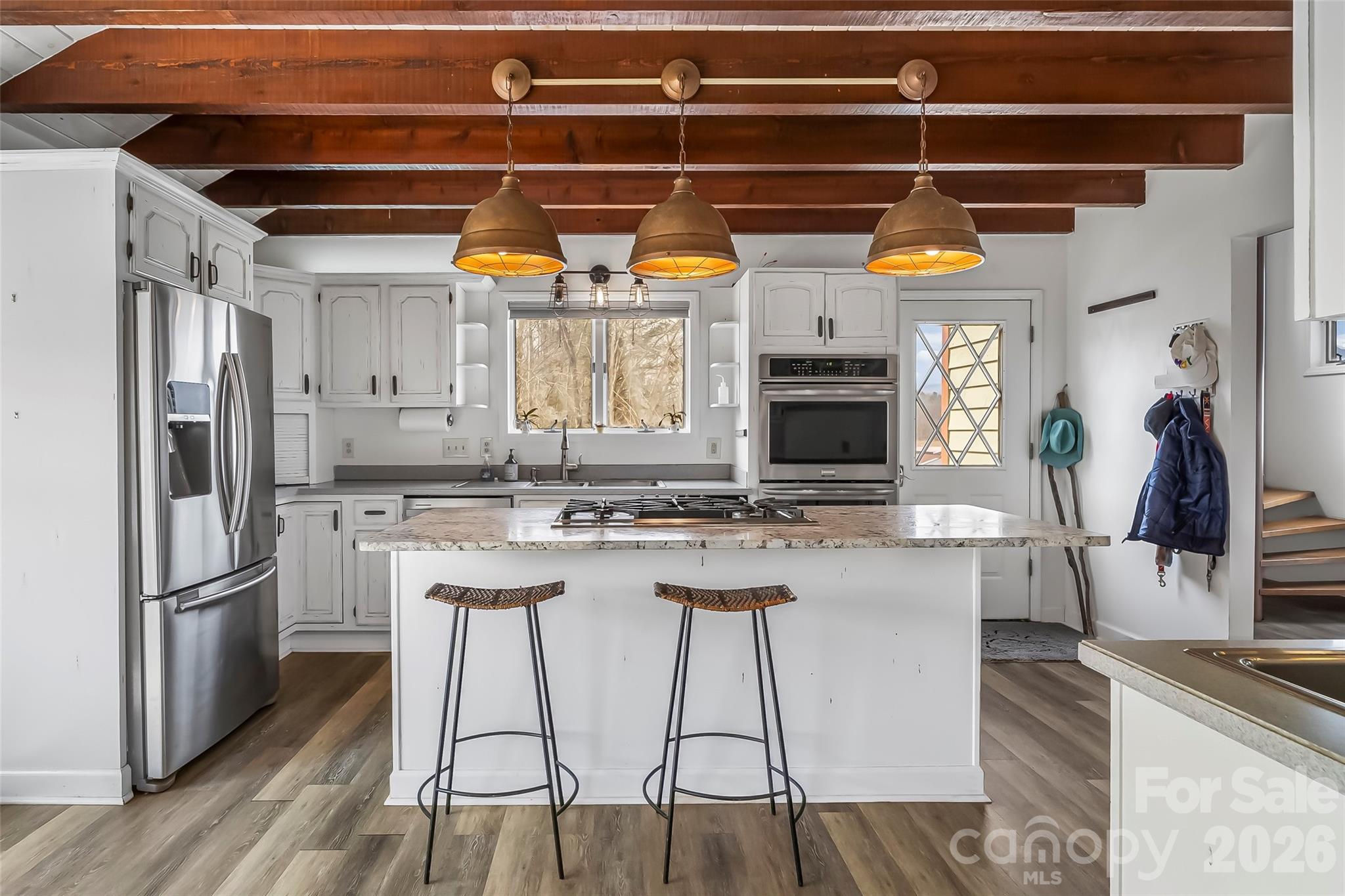 2590 Airport Road Marion, NC 28752 - Photo 14 of 48 a kitchen with refrigerator and cabinets