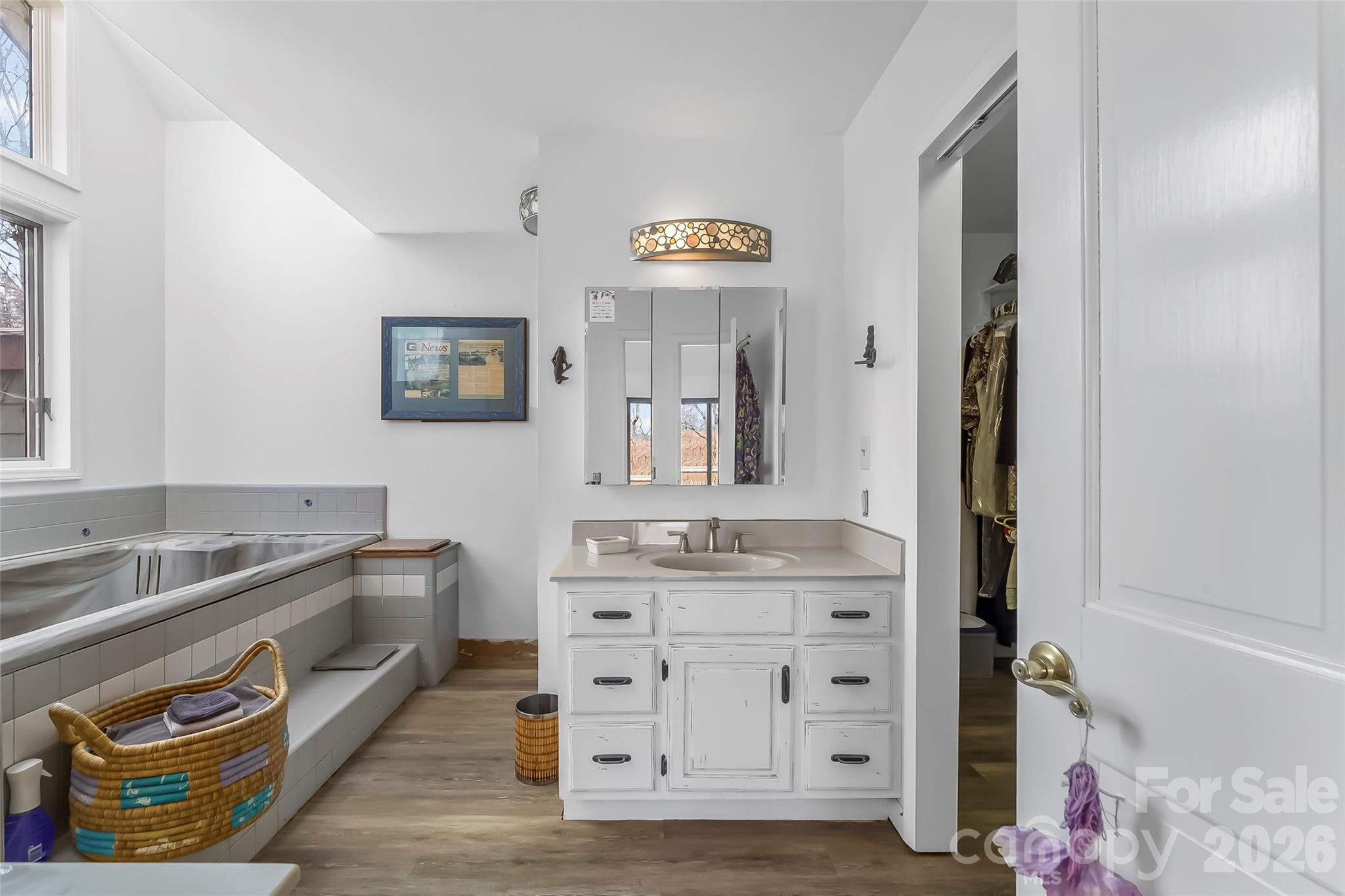 2590 Airport Road Marion, NC 28752 - Photo 24 of 48 a spacious bathroom with a tub sink and mirror