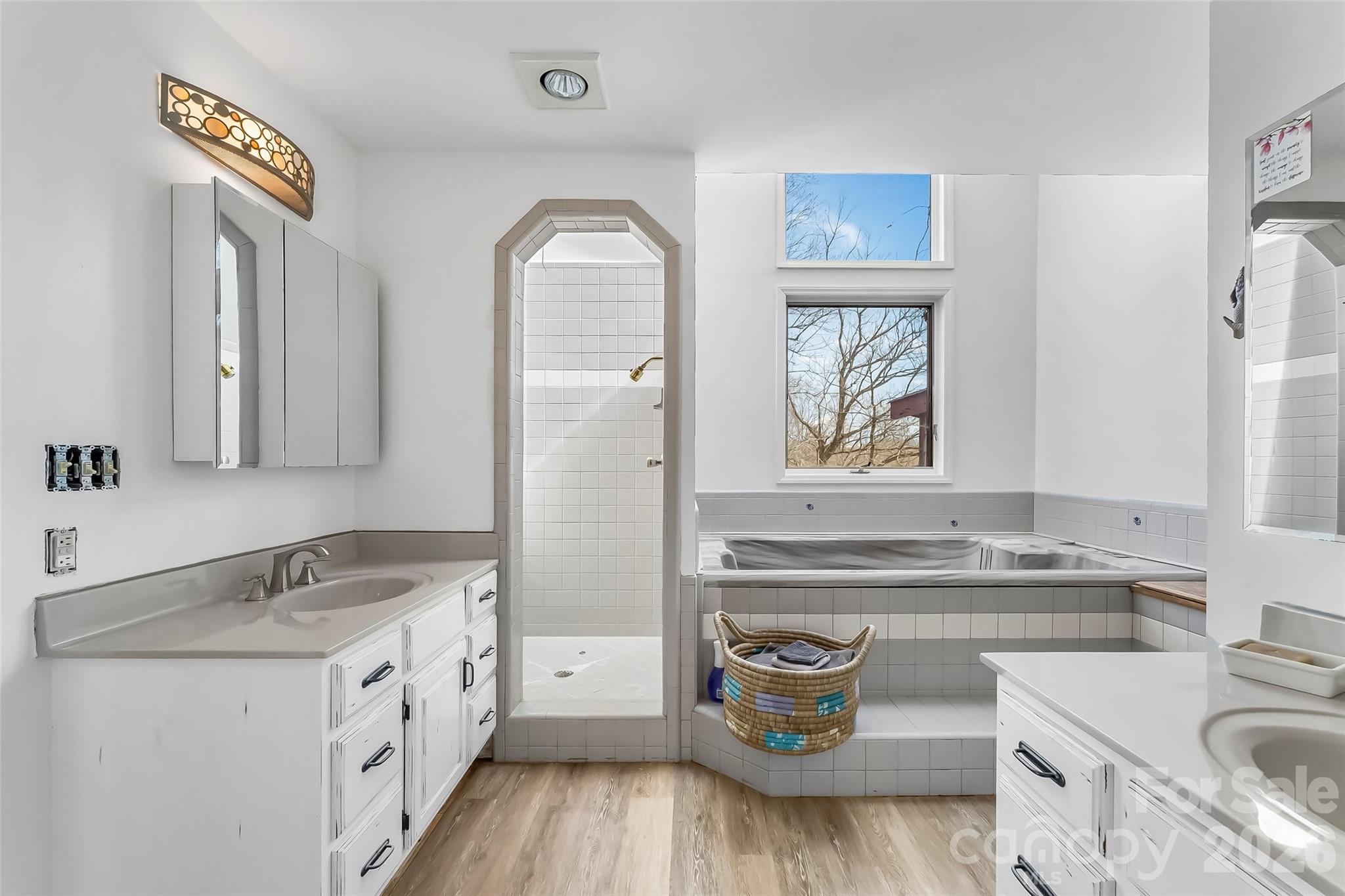 2590 Airport Road Marion, NC 28752 - Photo 26 of 48 a bathroom with a granite countertop sink a toilet and a mirror