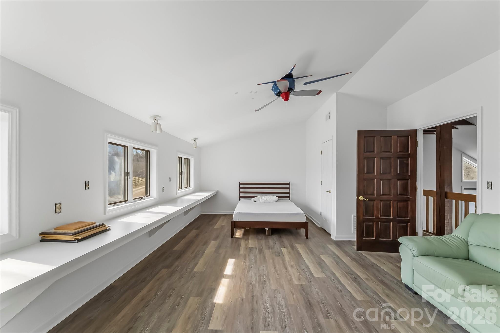 2590 Airport Road Marion, NC 28752 - Photo 28 of 48 a living room with furniture and a wooden floor