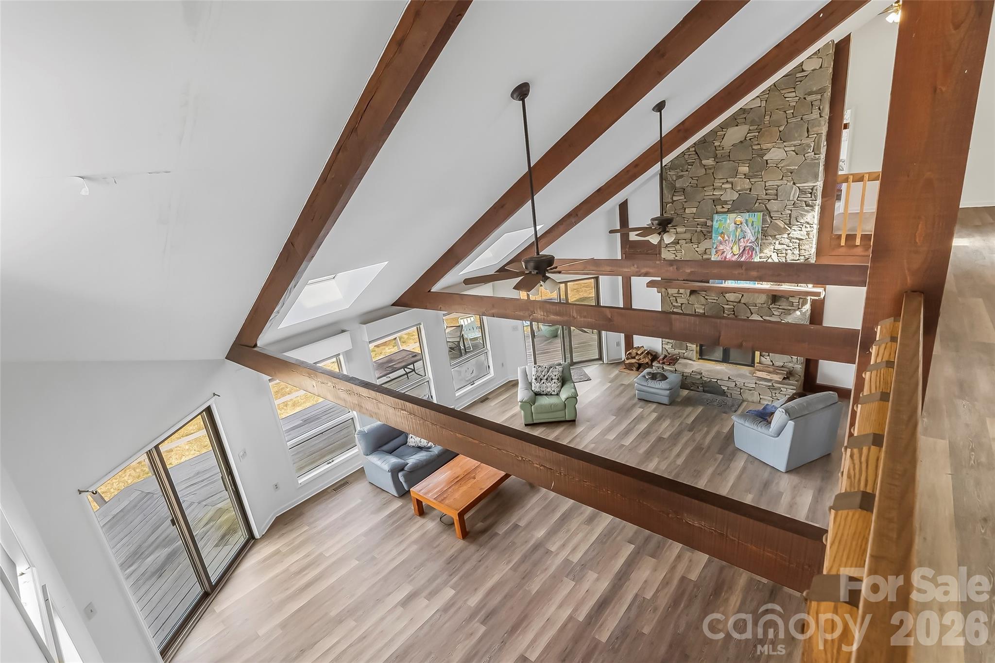 2590 Airport Road Marion, NC 28752 - Photo 29 of 48 a hallway with wooden floor and furniture