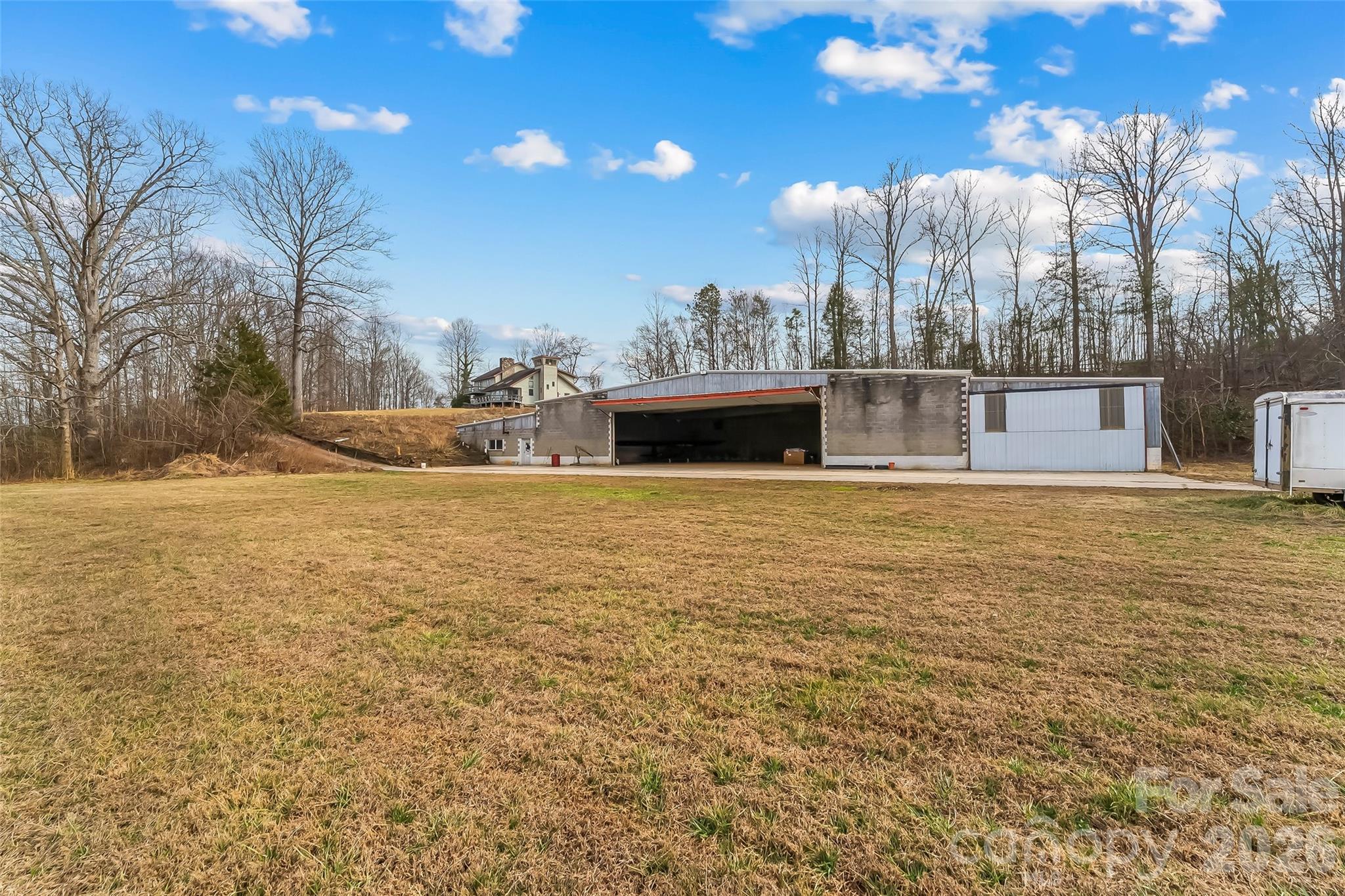 2590 Airport Road Marion, NC 28752 - Photo 40 of 48 a view of a house with a yard