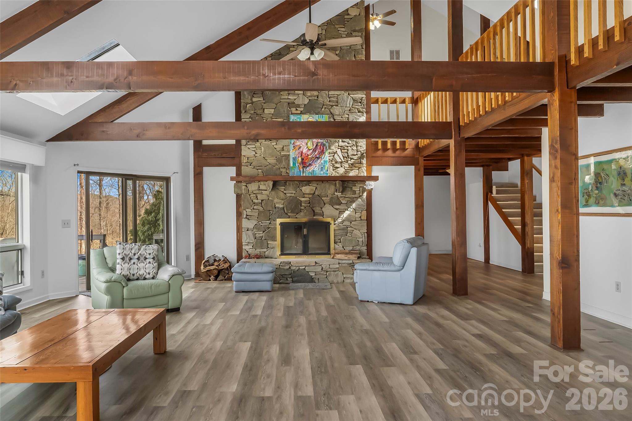 2590 Airport Road Marion, NC 28752 - Photo 8 of 48 a living room with furniture wooden floor and a fireplace