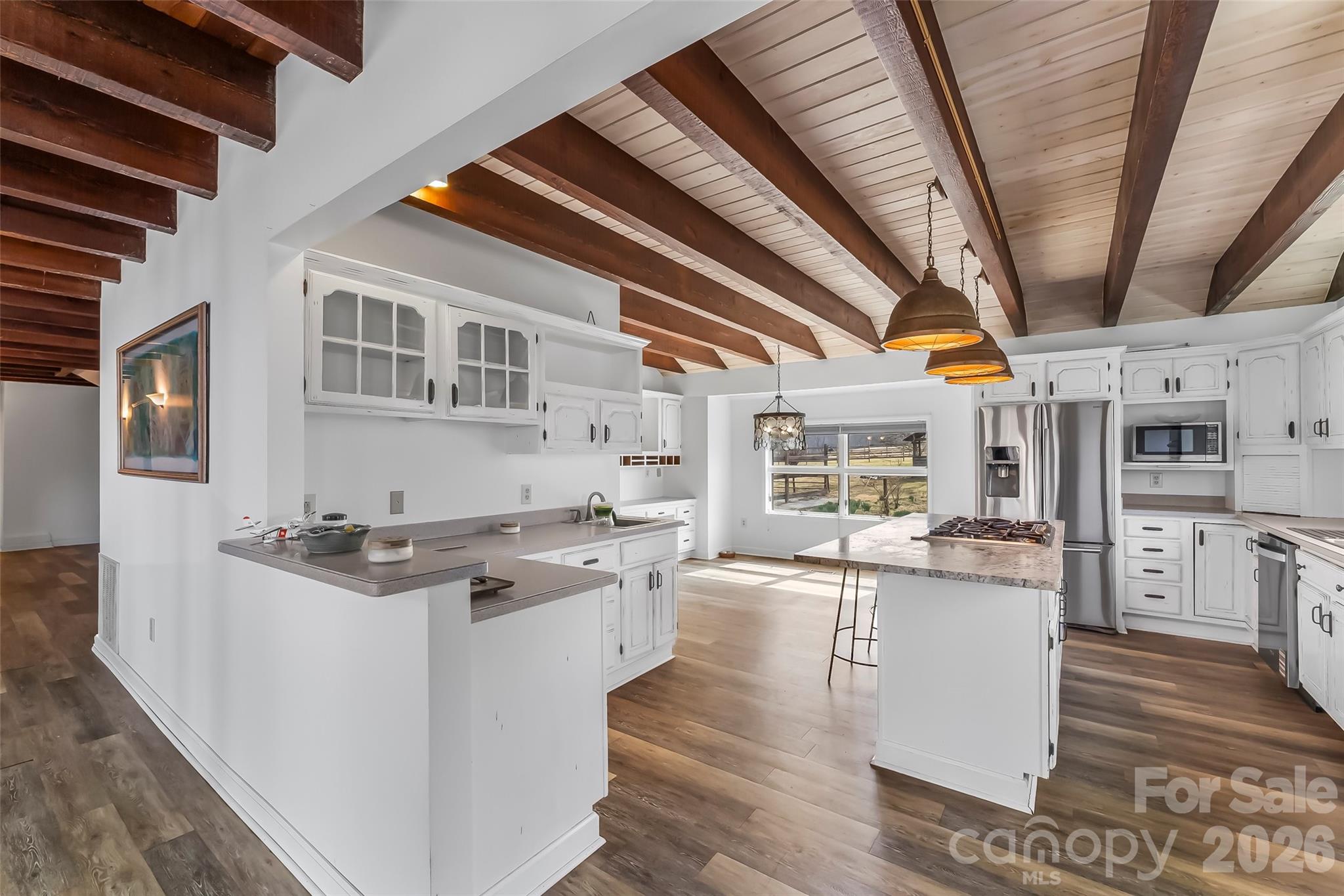 2590 Airport Road Marion, NC 28752 - Photo 10 of 48 a kitchen with stainless steel appliances granite countertop a stove and cabinets
