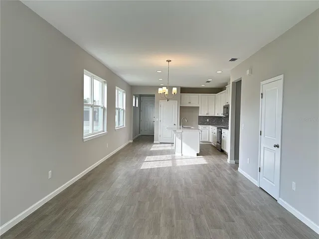 a view of a kitchen with a sink and a window