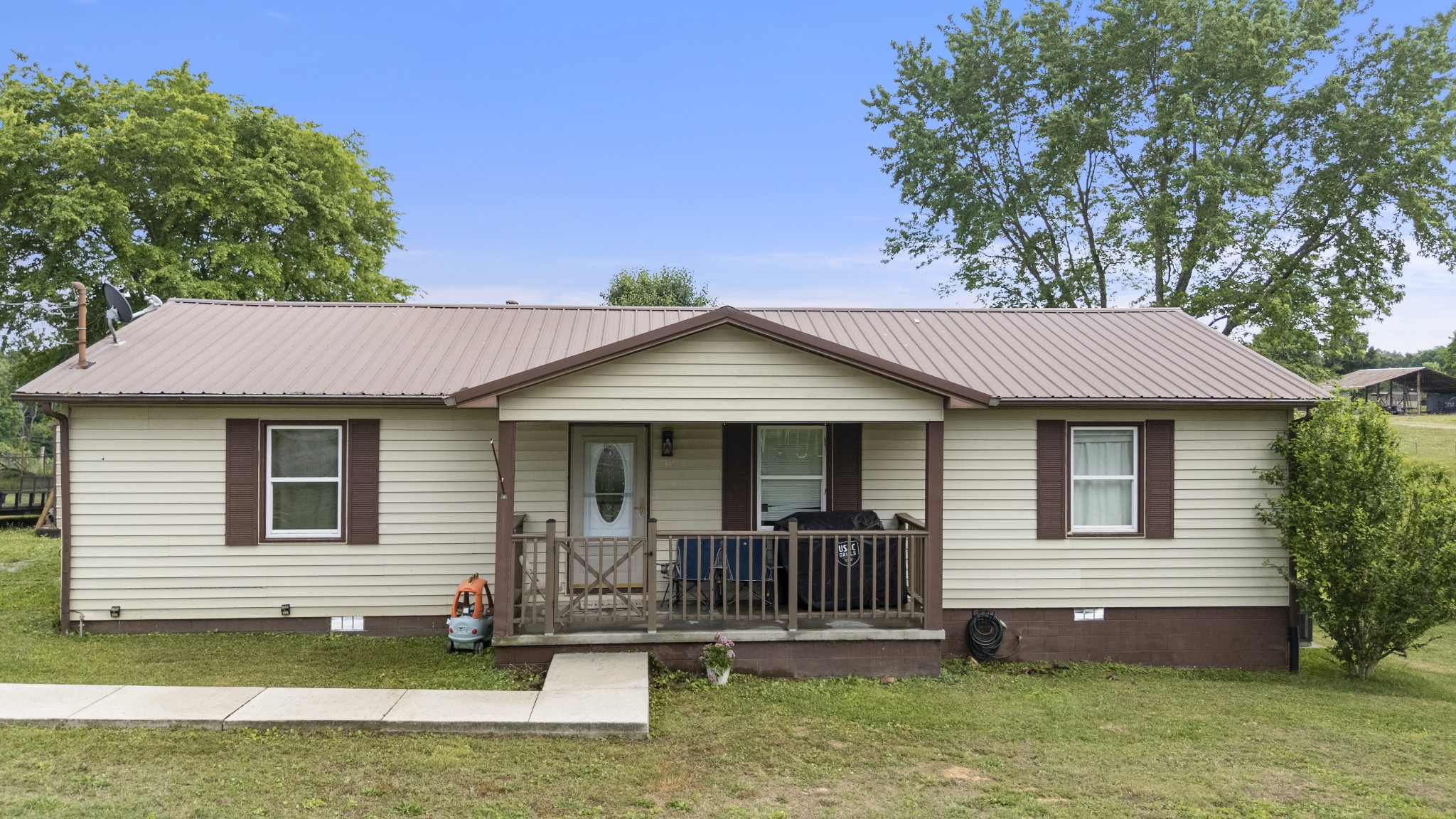 421 Shady Grove Road Flintville, TN 37335 - Photo 1 of 33 a front view of a house with a yard