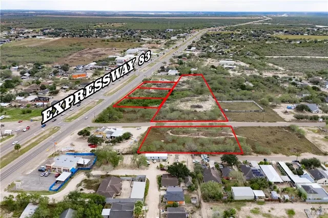 an aerial view of city and ocean