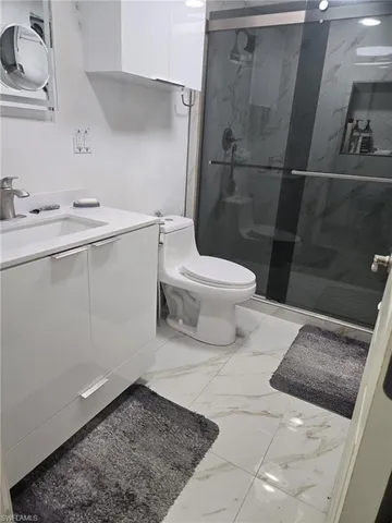 a bathroom with a toilet and a sink