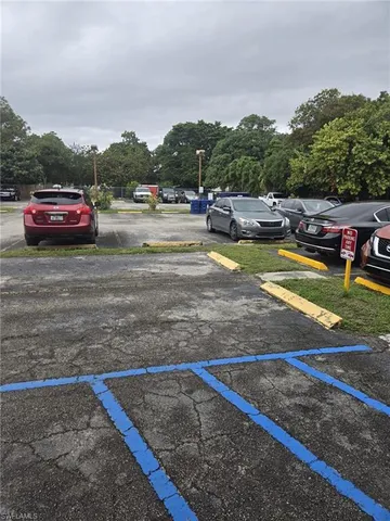 a view of a swimming pool with a yard and mountain view