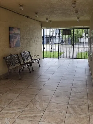 a view of a patio with table and chairs with wooden floor