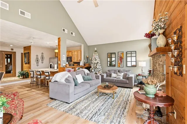 a living room with fireplace furniture and a flat screen tv