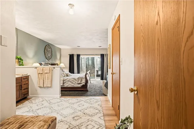 a bedroom with a bed and glass window