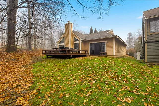 a view of a balcony with chair and table in the patio