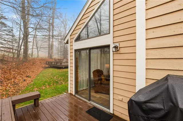 swimming pool with outdoor seating and wooden floor