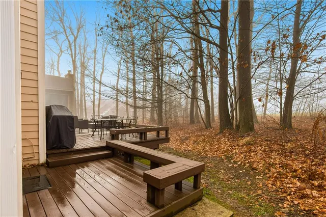 an aerial view of residential houses with outdoor space and swimming pool