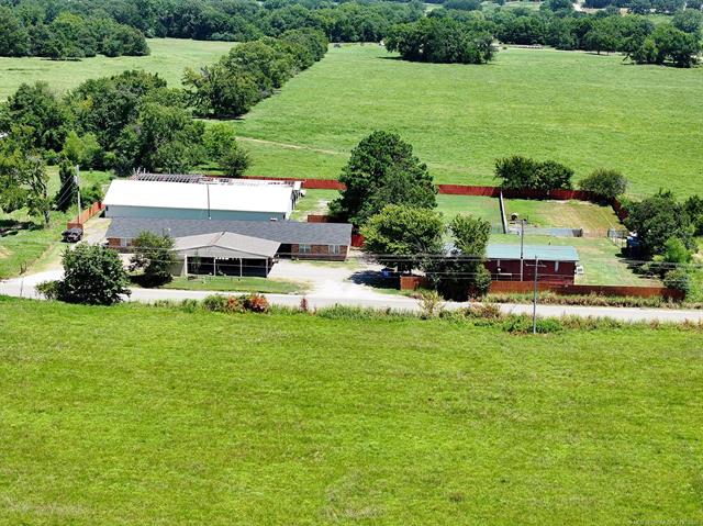 107903 South 4570 Road Sallisaw, OK 74955 - Photo 1 of 35 Expansive property featuring multiple structures, a covered carport, and a perimeter fence