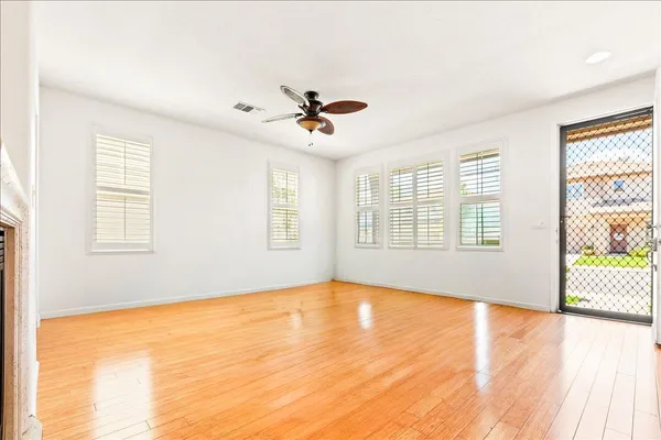 a kitchen with stainless steel appliances granite countertop a sink a stove top oven a counter space and cabinets